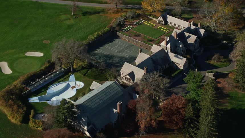 Aerial panorama of a hotel with sports areas swimming pool and golf courses