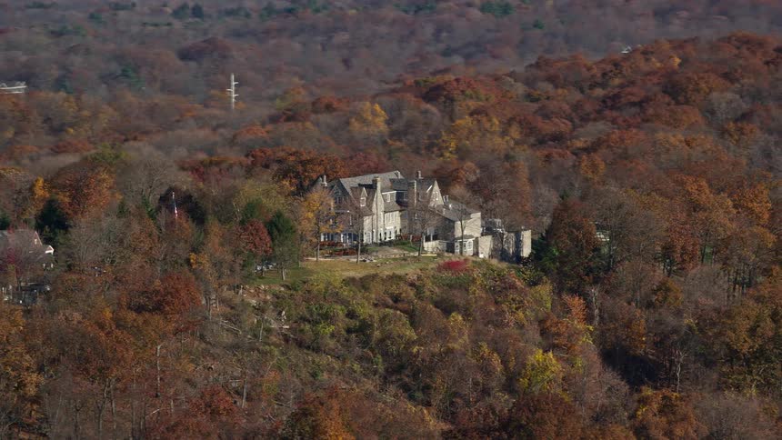 Aerial view of a mansion surrounded by nature
