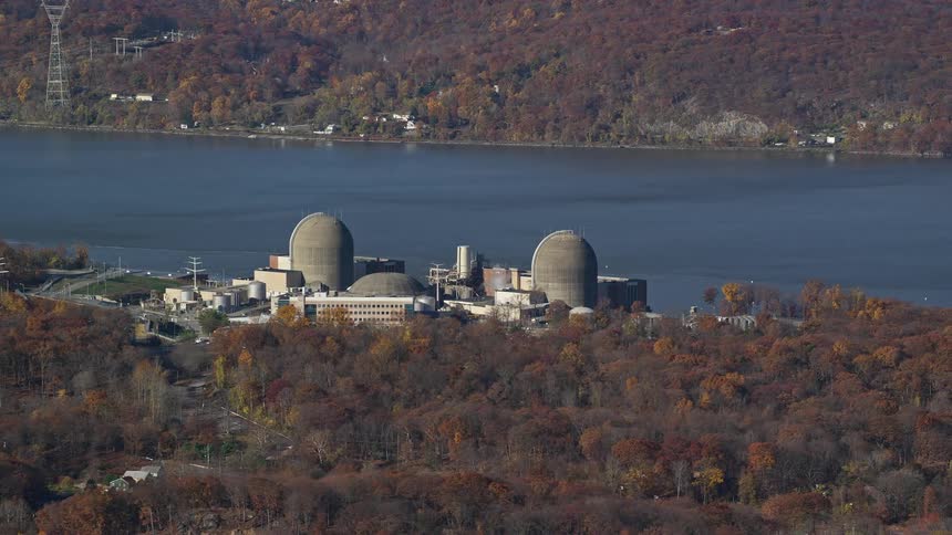 Aerial view of a factory by the edge of a lake