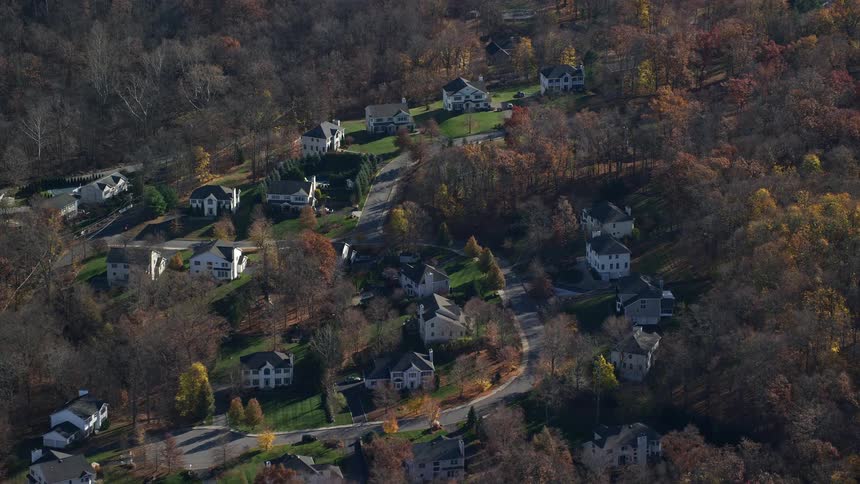 Aerial of houses in a suburban area at midday