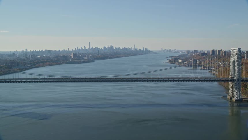 An aerial view of a bridge joining two coastal line