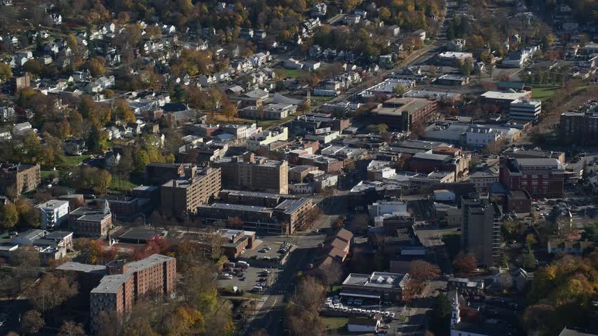 Aerial view of an urban city with houses and apartments during the day