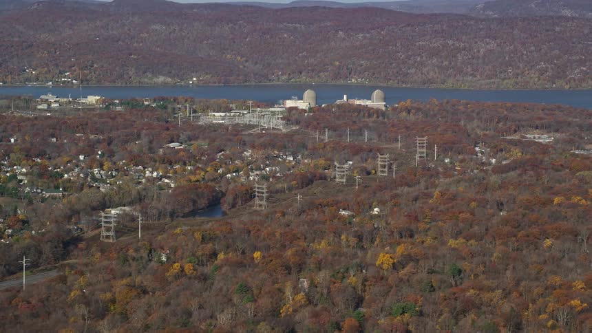 Aerial panorama of a forest and an urban city by the seaside