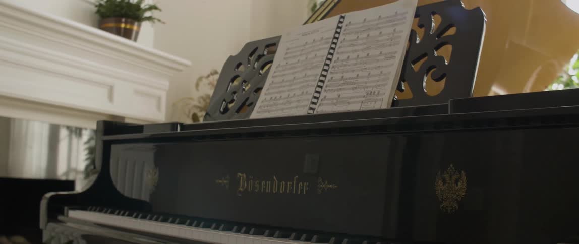 Sheet music sitting atop a piano