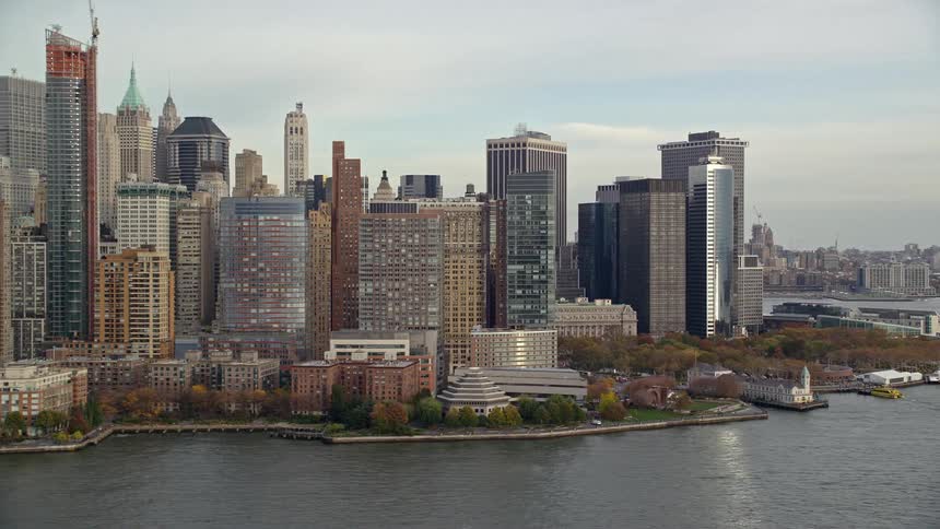 Landscape of skyscraper buildings at waterfront in a city at midday