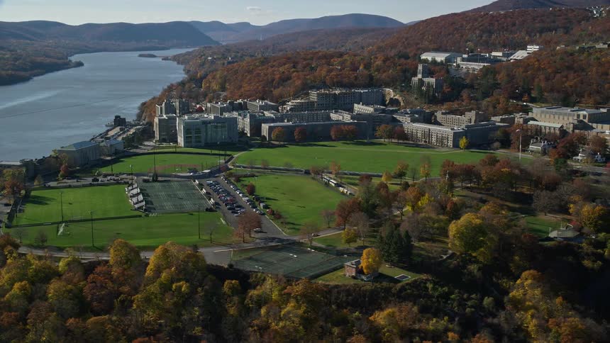 Aerial view of a building complex next to a river