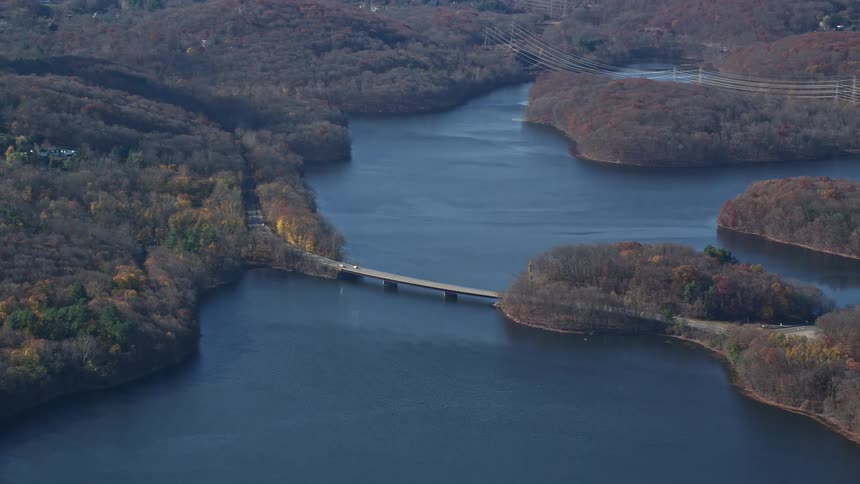 Aerial panorama of a bridge under the sea connecting a highway