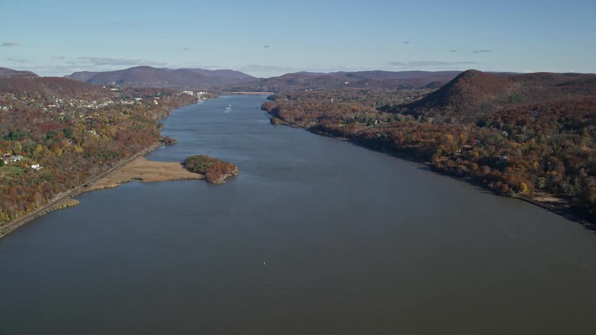 Aerial of a rural town next to a large river