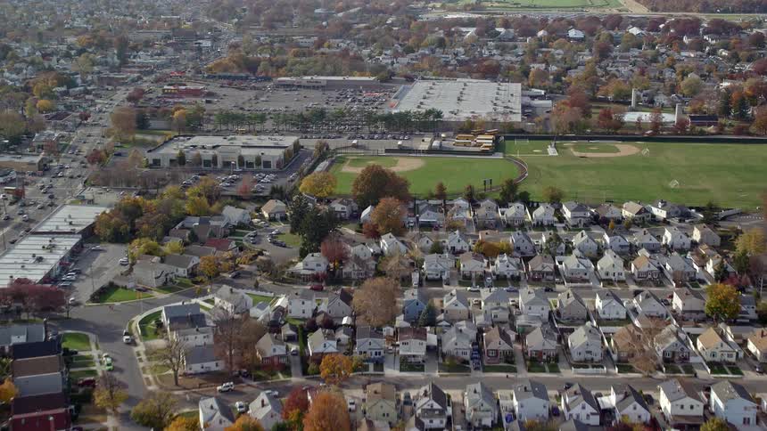 Residential area with rows of houses and sport fields