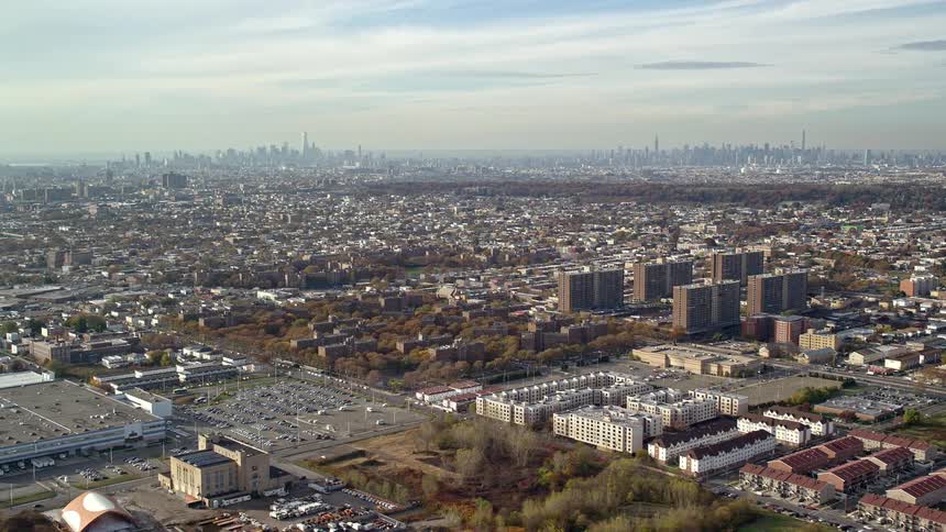 Aerial of buildings and cars in a metropolitan area at midday
