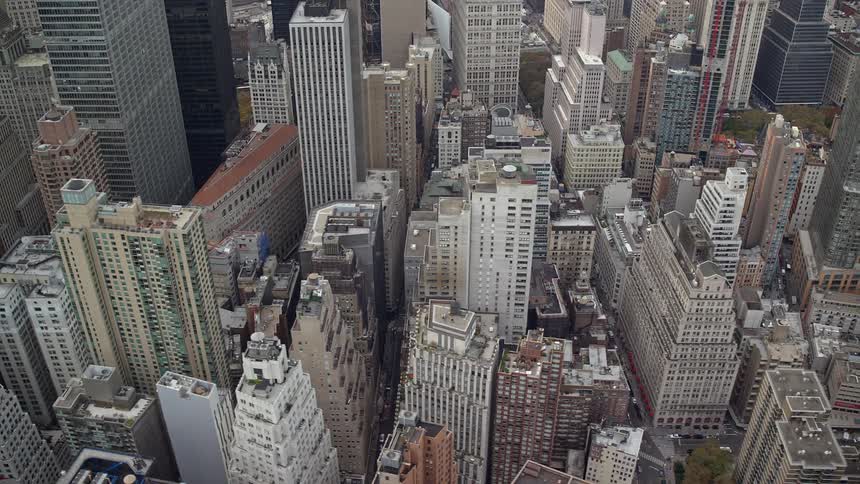 Aerial of a city with towers during the day