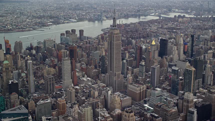 A large tower is in the middle of the city
