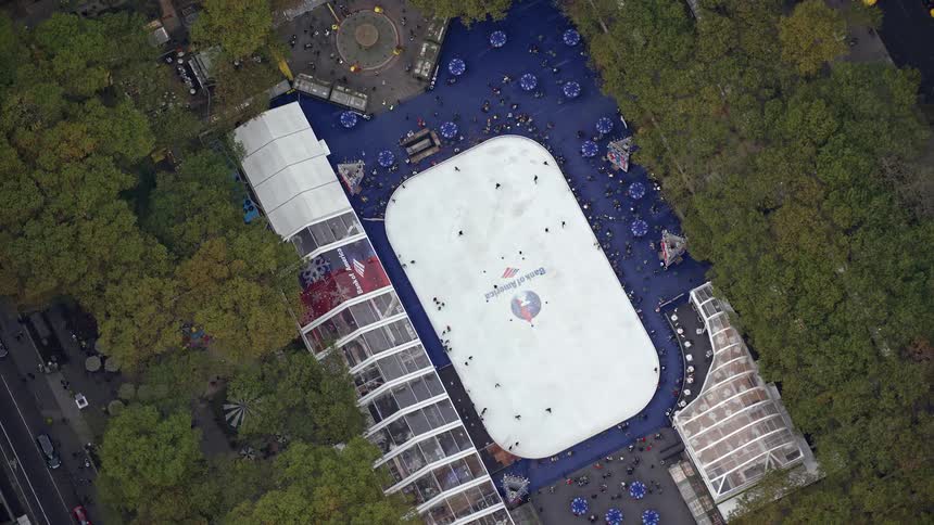Aerial view of an ice rink with people ice skating