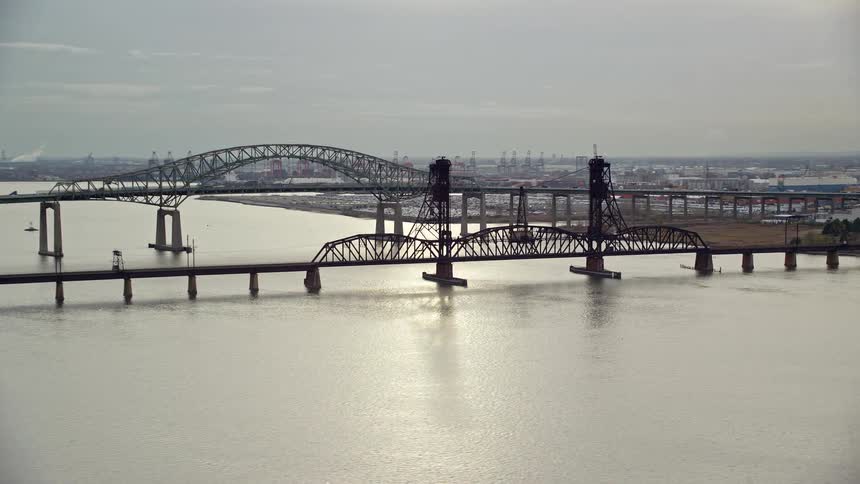 Aerial view of massive bridges over the sea under a morning sky