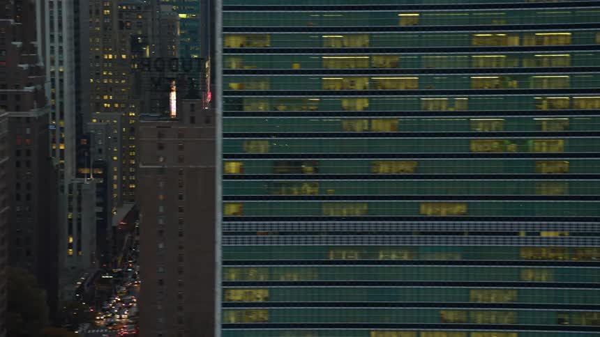 View of skyscrapers in a metropolis on crowded streets during the late afternoon traffic