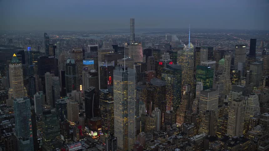 A night aerial view of metropolitan buildings filled with lights