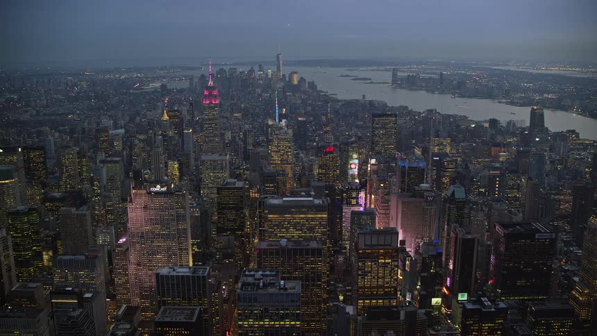 Aerial view of a metropolis with lights by the seaside