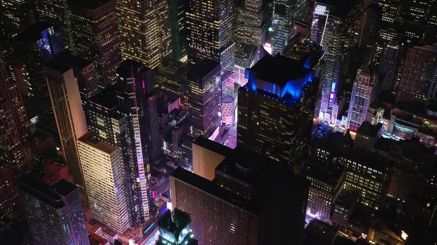 Aerial of skyscrapers in a metropolis area at night