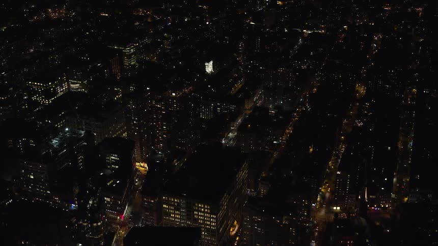 Aerial of buildings in a metropolitan area at night