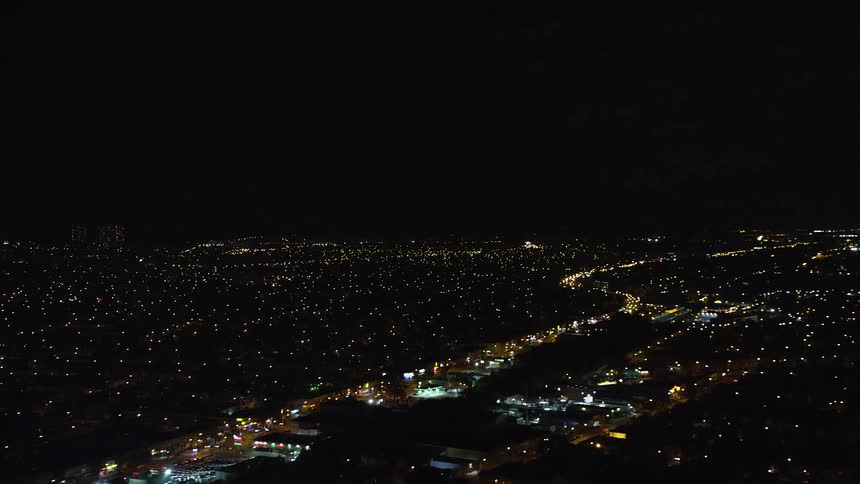 Aerial view of low city lights at night