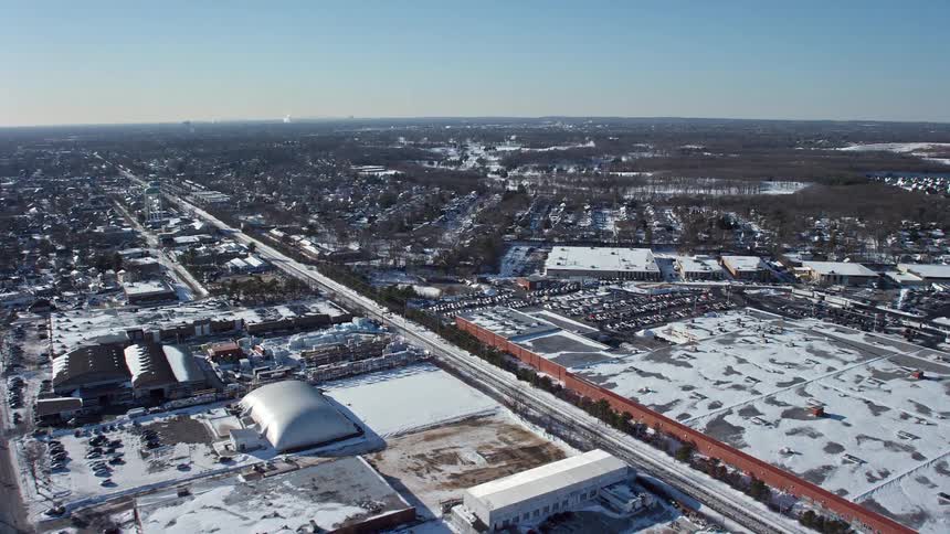 Aerial view of snow covered roofs of buildings during the day