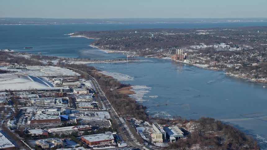 A residential area close to a large river that connects to the sea