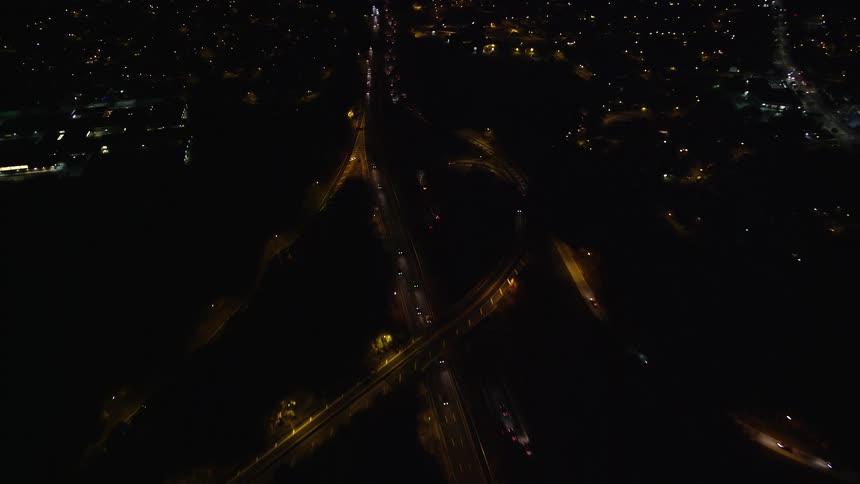 Aerial view of a highway through the city at night