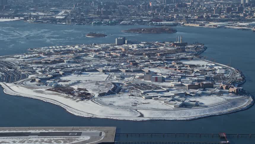 Aerial view of buildings on an island next to the city