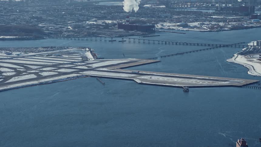 Aerial of manufacturing areas connected by bridges during winter