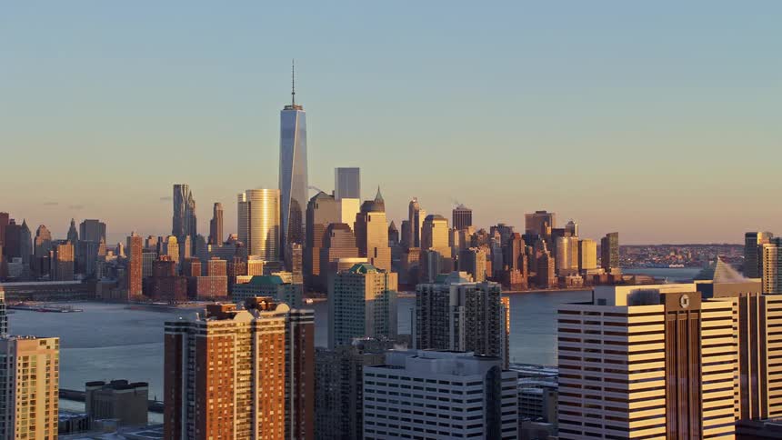 One world trade center and other skyscrapers in new york at sunset
