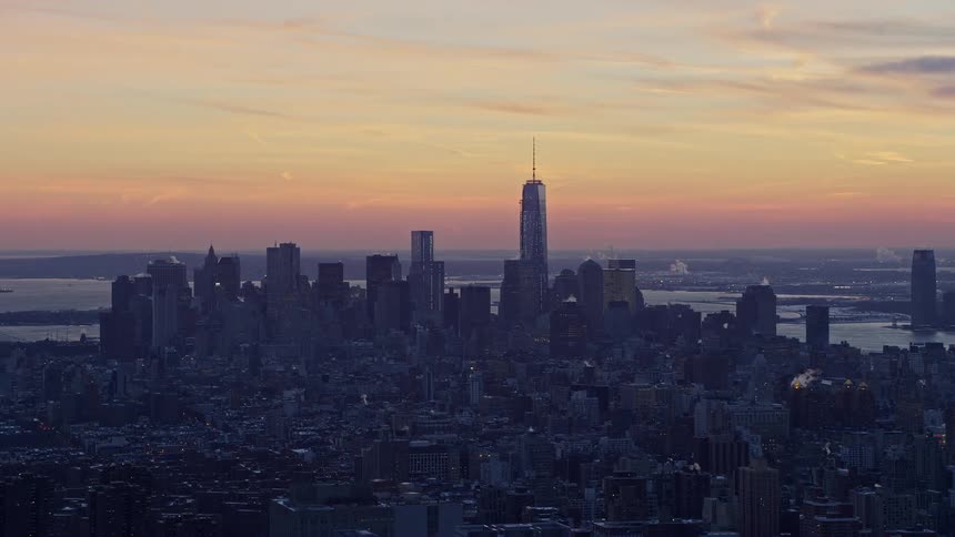 A metropolitan city on a morning with an orange sky