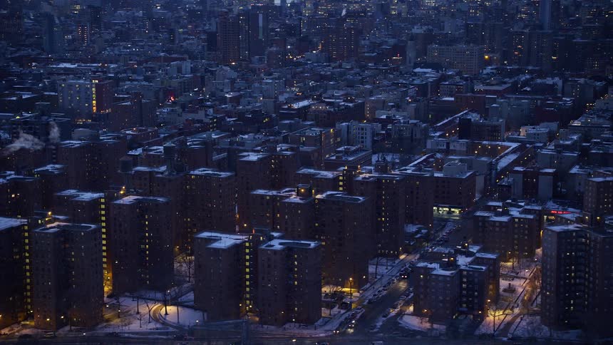 Aerial panorama of a snowy nighttime metropolis