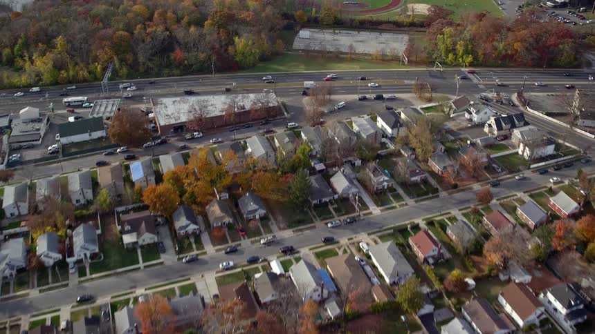 Aerial of residential area and track field