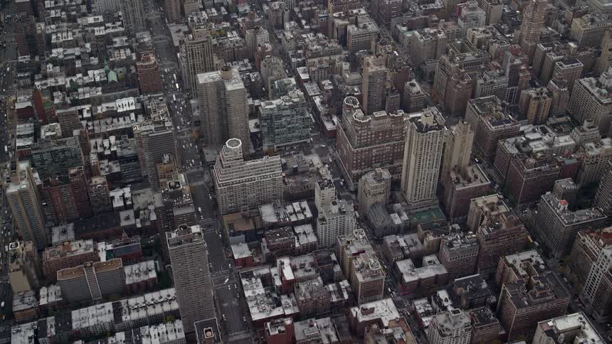 A view of a city with lowrise buildings and several houses