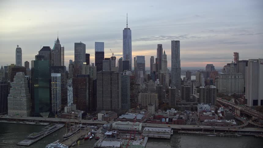 A metropolitan region with very tall buildings and the city is facing the sea