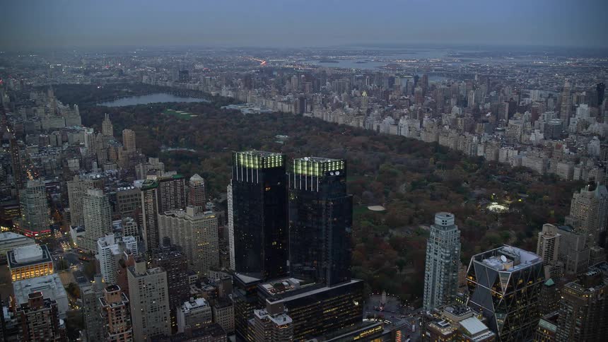 Aerial of buildings in a metropolitan area at sunset