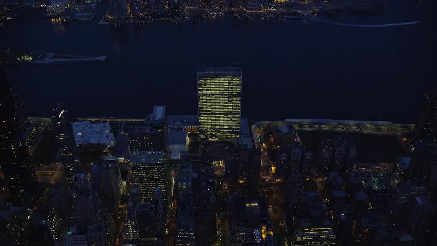 Aerial of skyscrapers in a metropolitan area at night