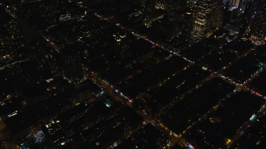 Aerial of buildings in a metropolitan area at night