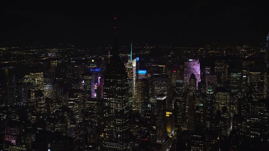 Aerial view of buildings and skyscrapers at night