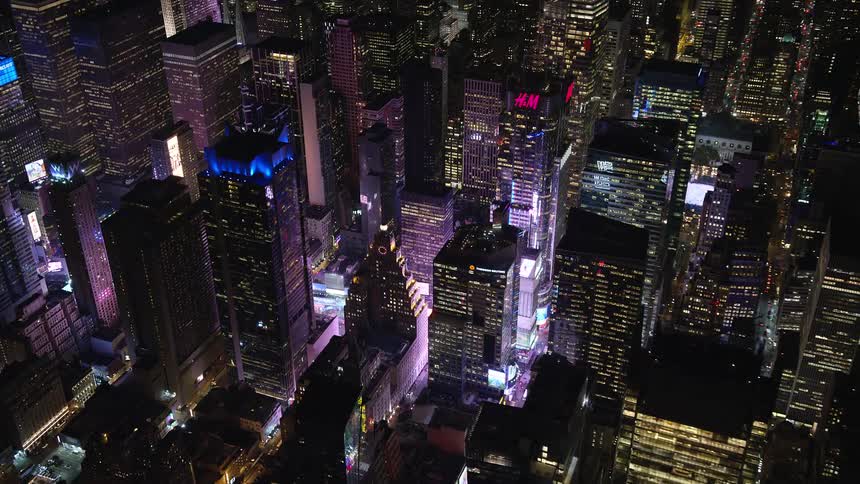 A metropolitan city center with bright lights