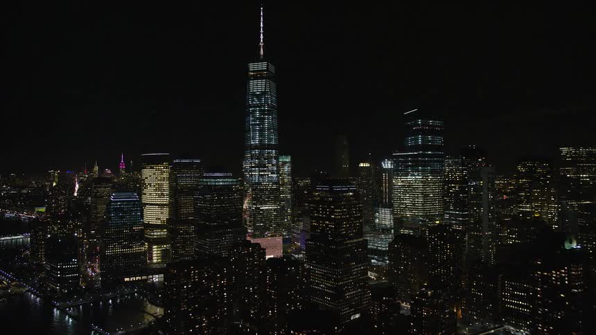 Skyline of illuminated towers at night in metropolitan city