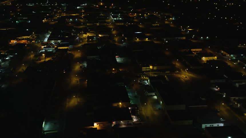 The city is partially lit at night
