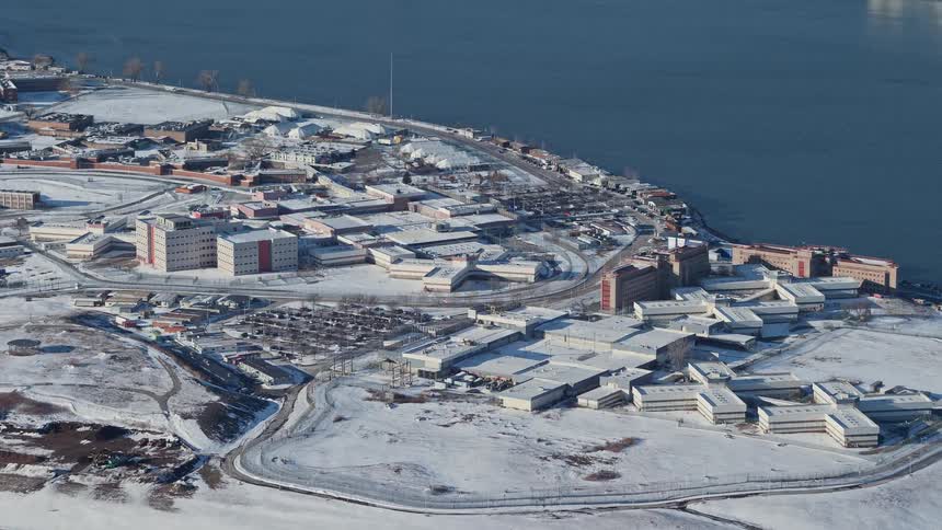 Aerial view of buildings by the seaside in winter with snow
