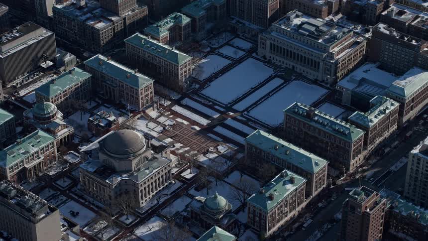 Aerial of buildings in a metropolitan area on a sunny day