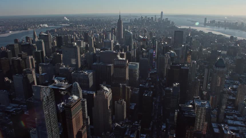 A huge metropolitan city with huge buildings and is close to the sea