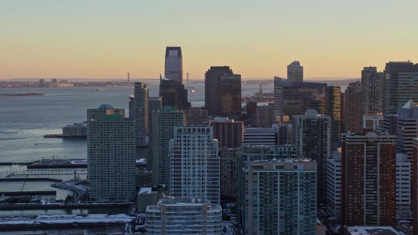 Aerial panorama of a coastal metropolitan city under a morning sky