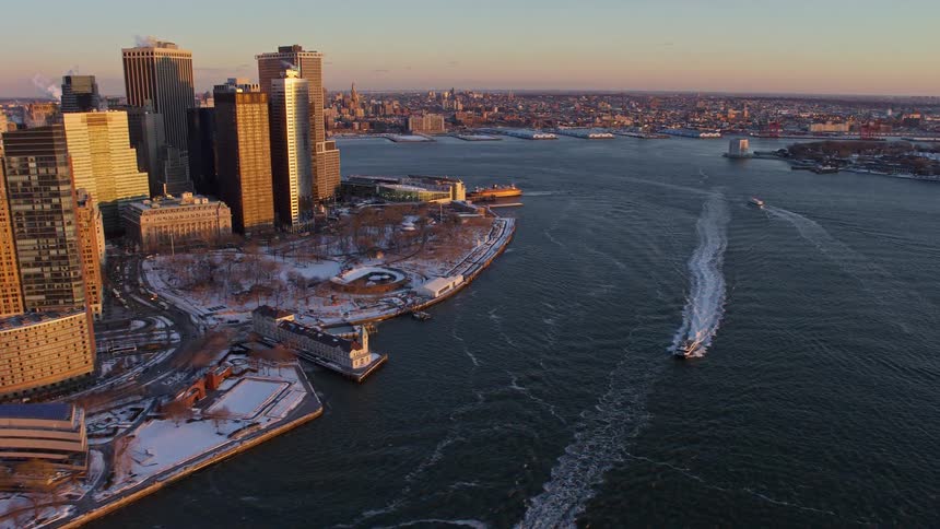 Aerial view of a metropolis by the sea with boats and a morning sky in winter