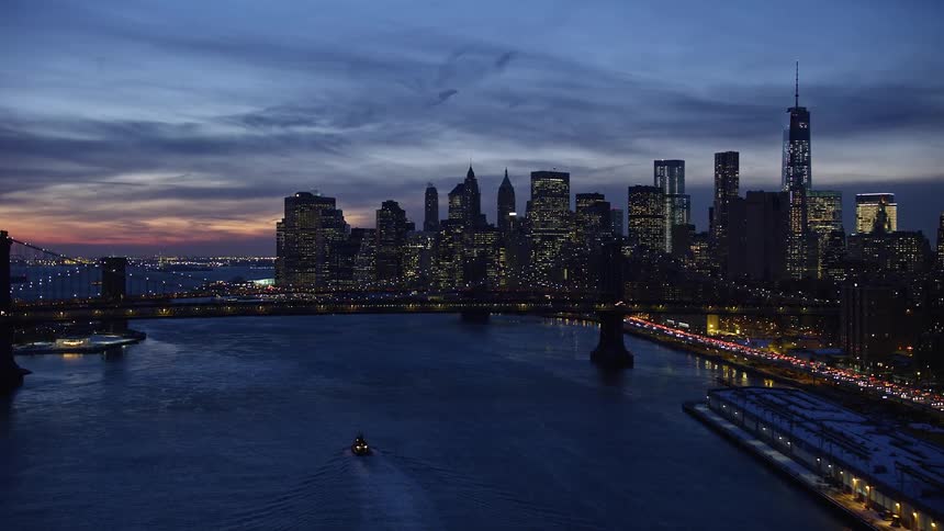 Bridge waterways and buildings in a metropolitan area at dusk