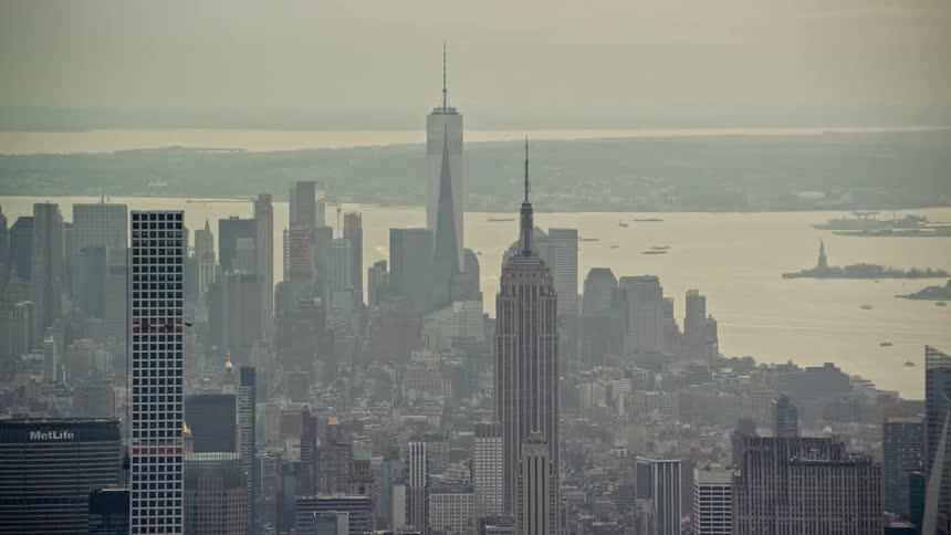 Aerial panorama of a coastal metropolis with the morning sky