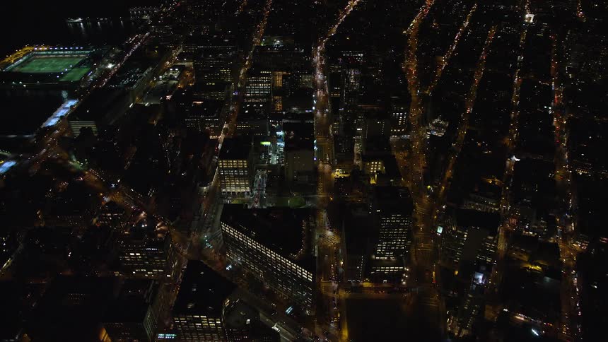 Light from high rise buildings shines at night in the city
